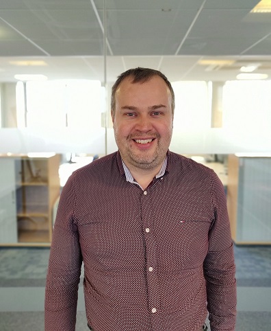 Photo of me! I'm wearing a dark brown / reddish shirt.