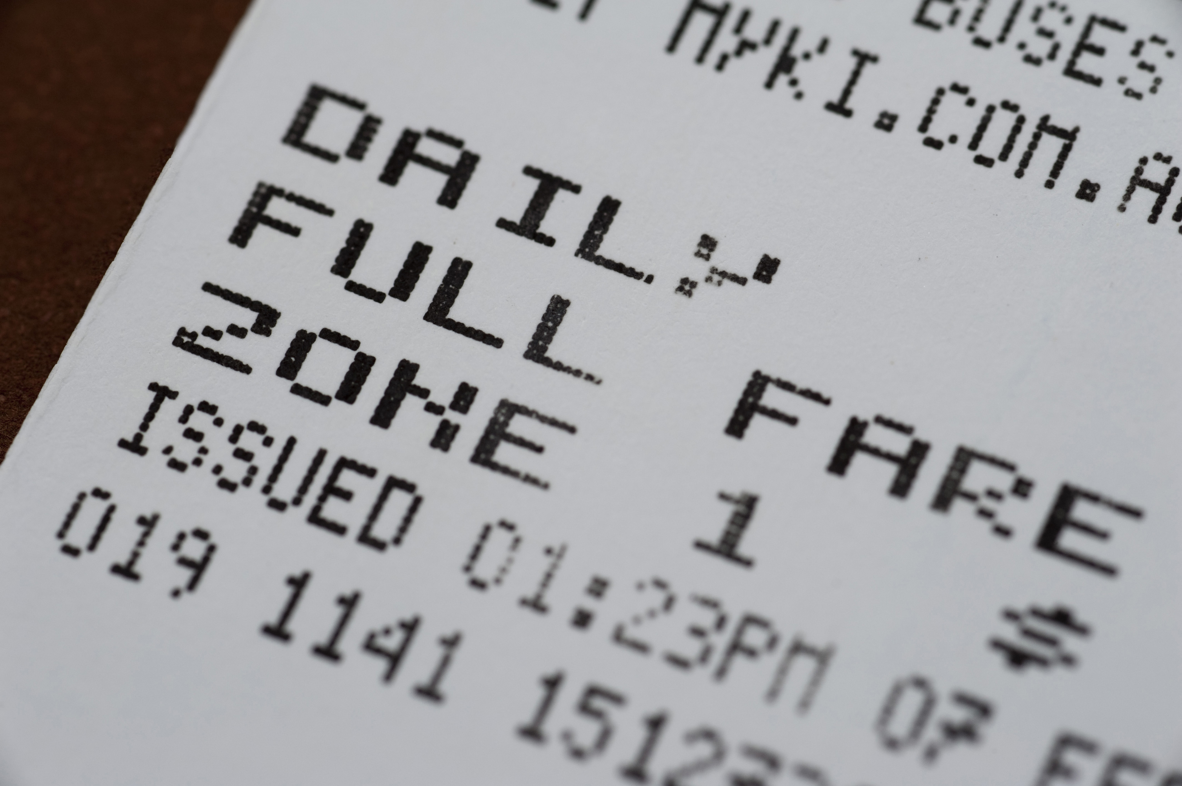 a close up of a bus ticket. it says daily full fare, zone 1. that's it