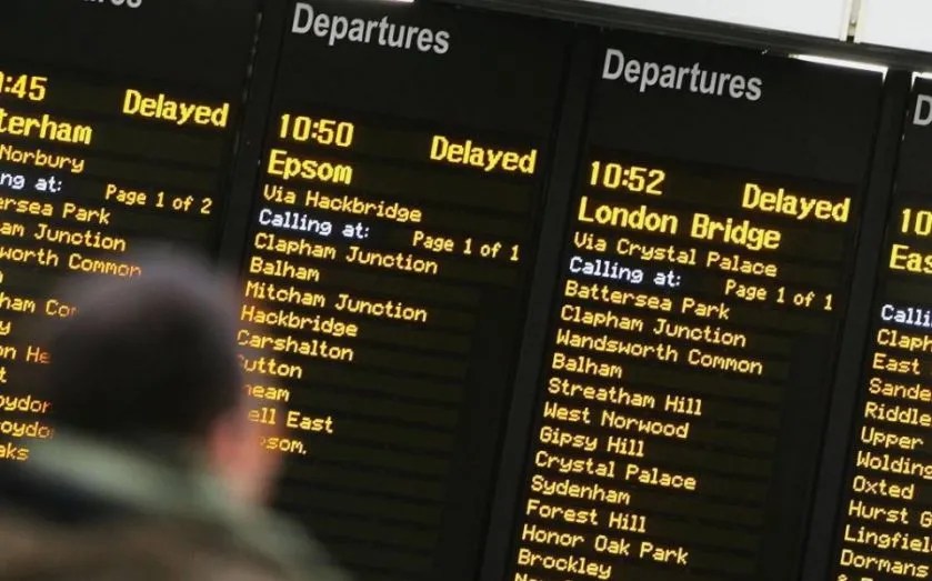 departure boards showing delayed trains